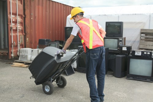 Professional skip hire team assisting a business site